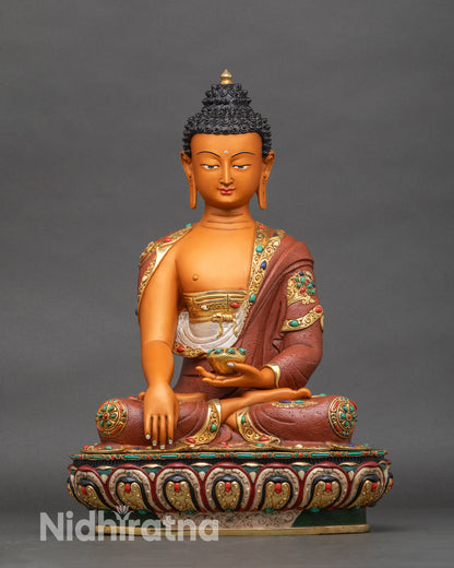 Yellow-hued Shakyamuni Buddha statue on lotus pedestal, Nepalese copper art