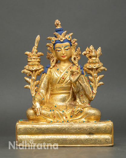 Yuthok Yonten Gonpo statue seated on pedestal, gold-painted face, copper figure