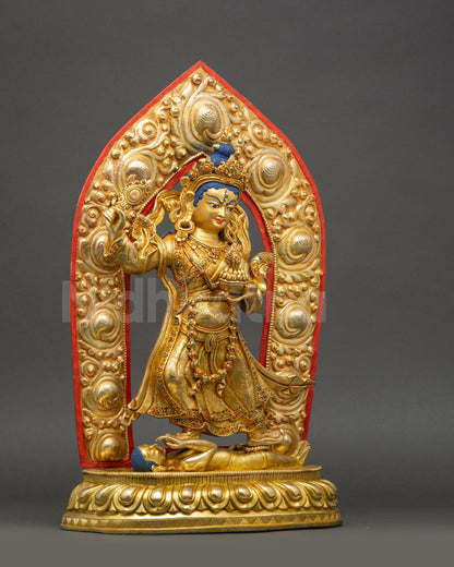 Achi Chokyi Drolma statue holding ritual mirror and kapala topped with wish fulfilling Chintamani