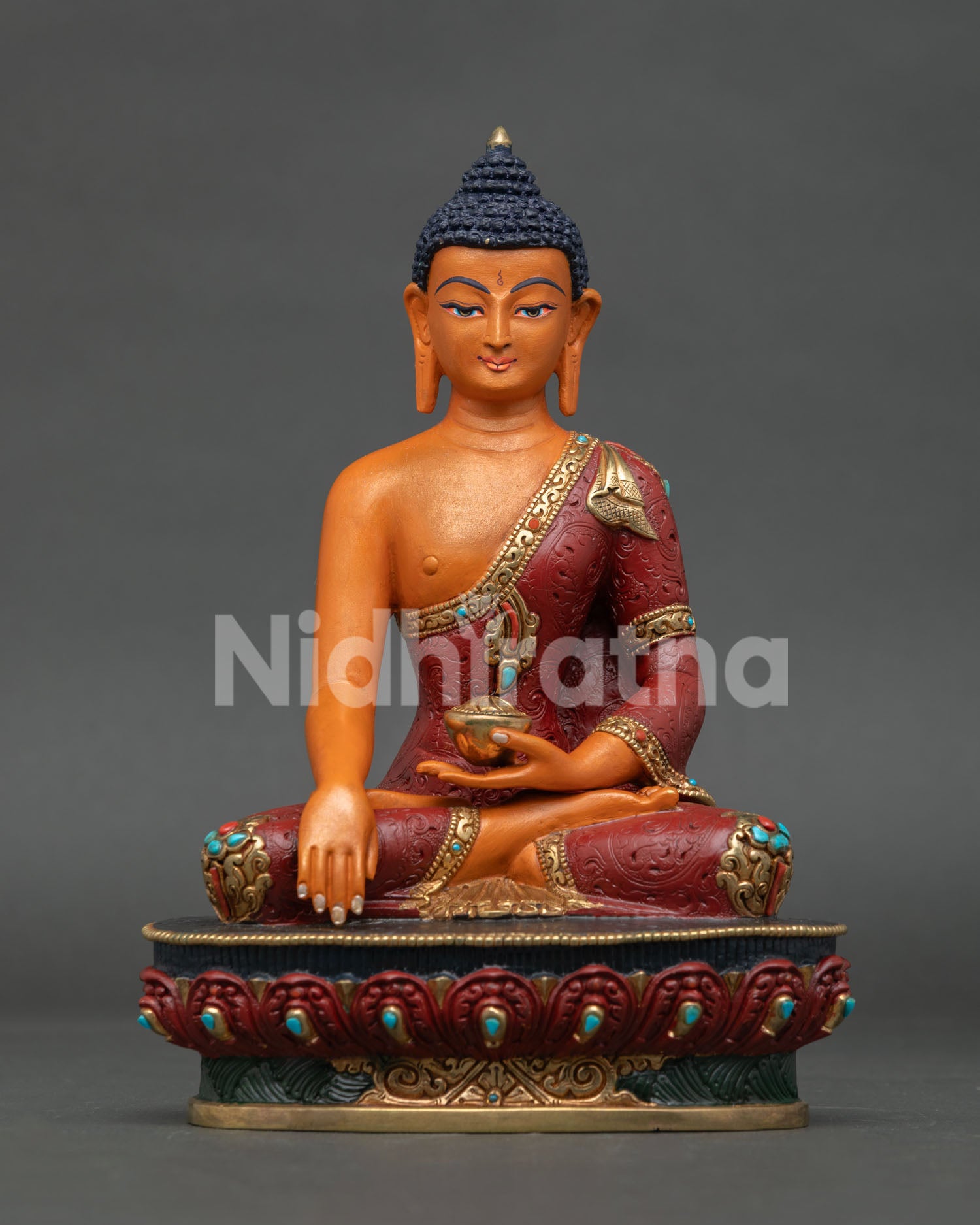 Acrylic-painted Shakyamuni Buddha statue with copper body and red robe from Nepal