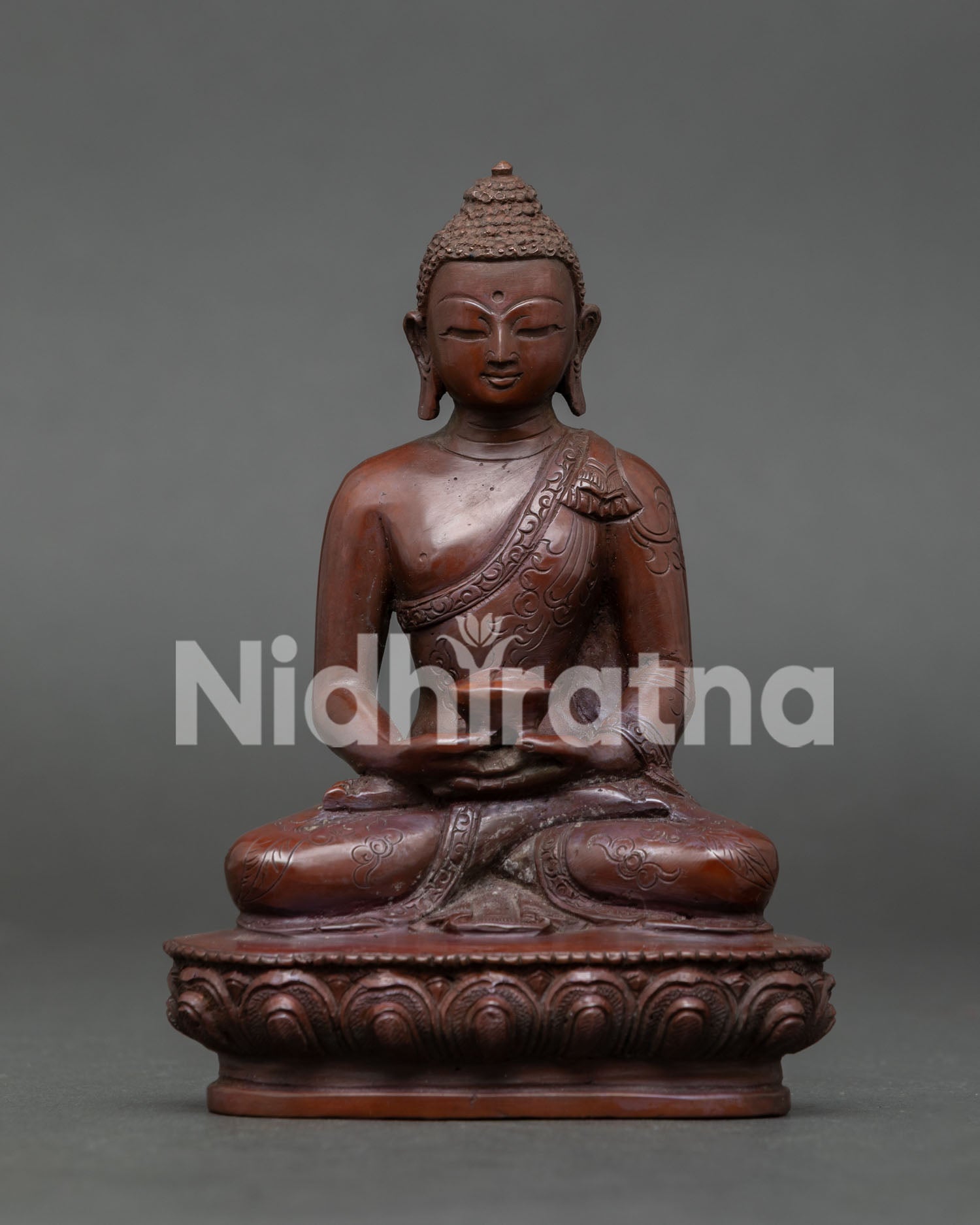 Amitabha Buddha statue handcrafted in Nepal copper with oxidized finish seated on lotus throne holding alms bowl.