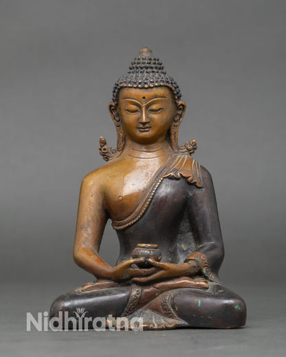 Amitabha Buddha statue meditation posture with begging bowl symbolizing infinite compassion Pure Land and boundless light oxidized copper Vajrayana art