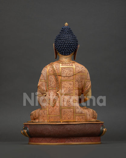 Amitabha Buddha back view, fire-gilded copper statue showing ornate robe details and decorative lotus base