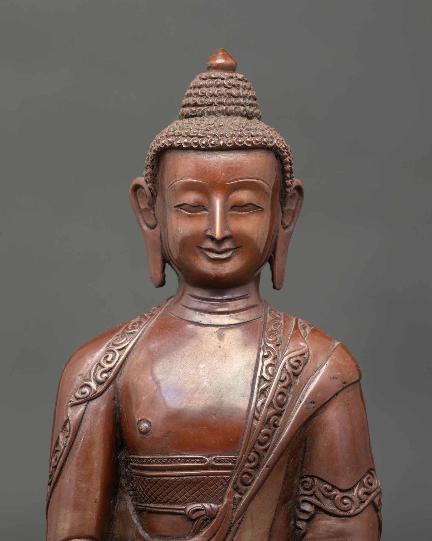 Amitabha buddha face showing serene expression and detailed nepalese craftsmanship.
