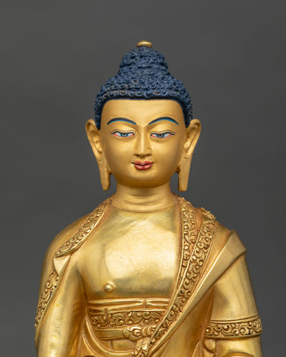 Amitabha Buddha statue 24K gold painted face Newari artistry Patan Nepal.