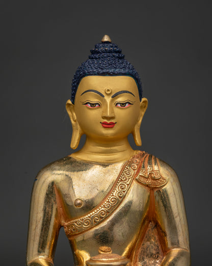 Amitabha Buddha Statue Close Up 24K Gold Painted Face and Serene Expression.