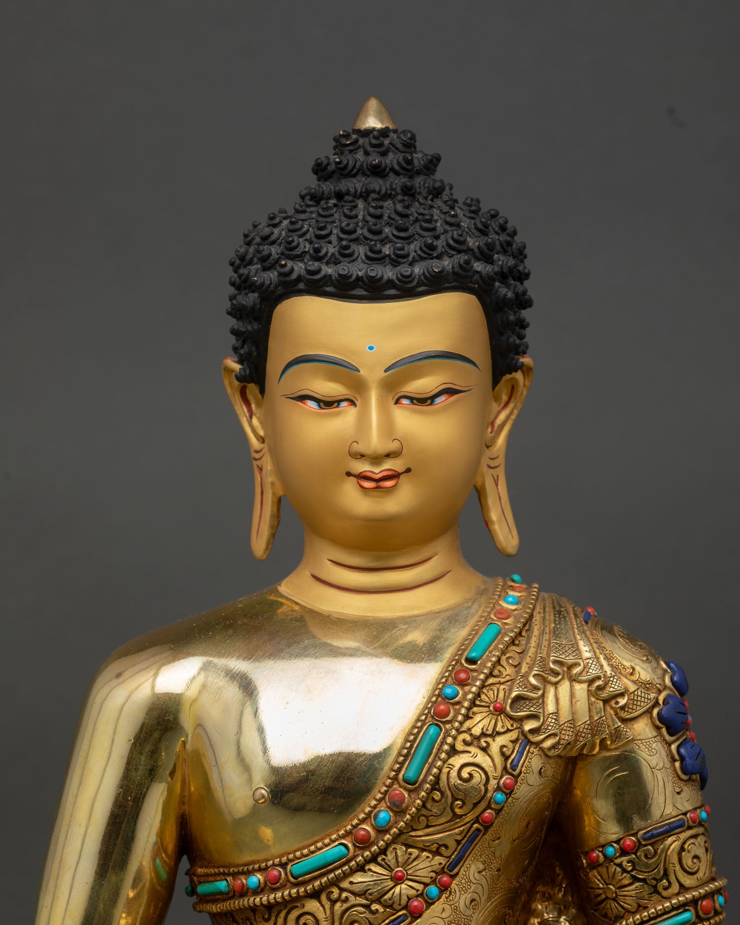 amitabha buddha statue close up, handcrafted copper gold gilded nepalese artwork