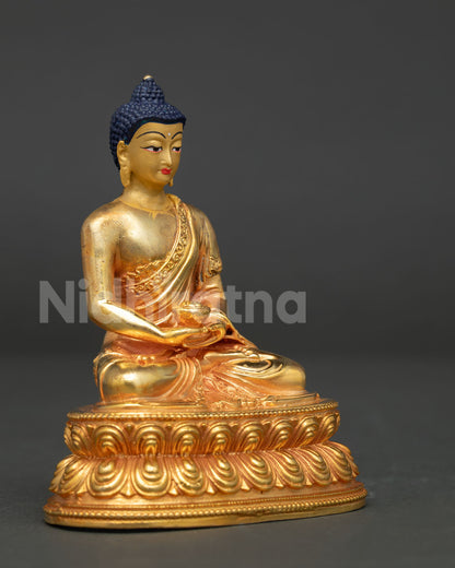 Amitabha Buddha statue detailed robe close up with hand carved floral motifs and alms bowl.