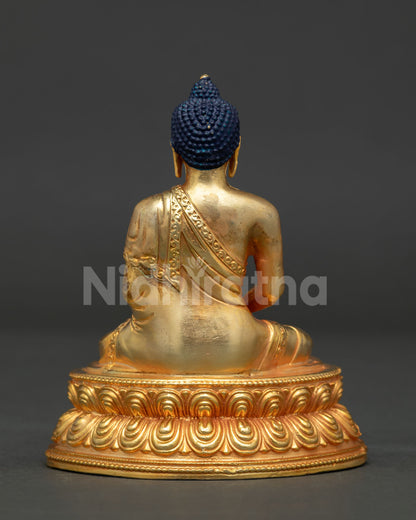 Amitabha Buddha statue detailed view showcasing gold gilding, copper casting and floral carvings.