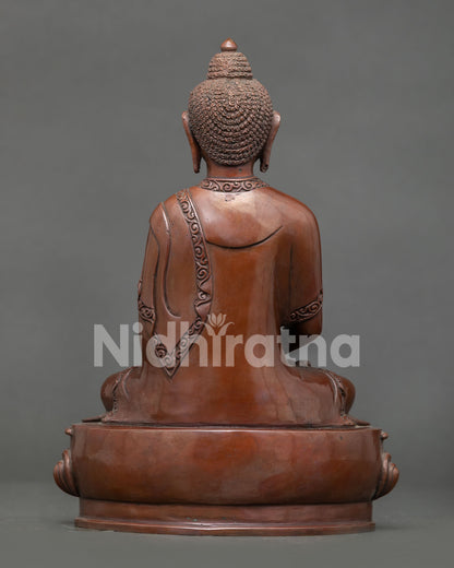 Amitabha buddha statue displaying intricate copper artwork and himalayan buddhist design