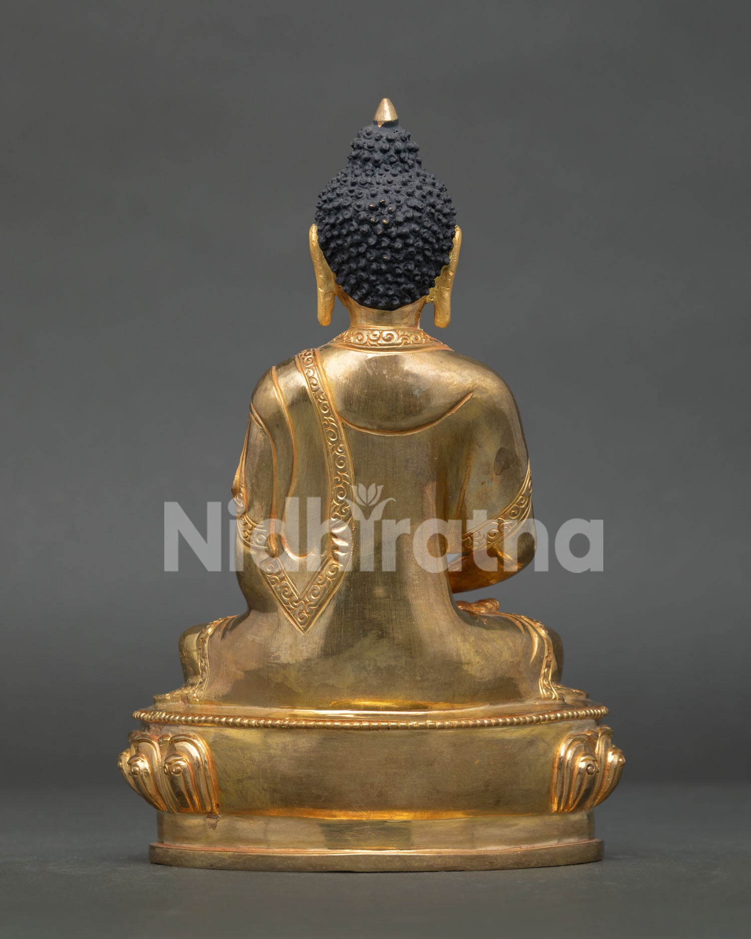 Amitabha buddha statue displaying intricate gold gilded artwork and nepalese craftsmanship.