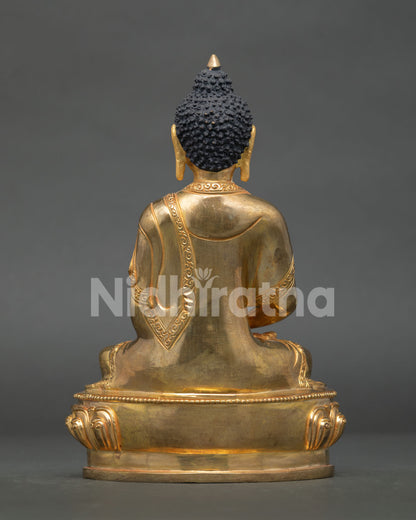 Amitabha buddha statue displaying intricate gold gilded artwork and nepalese craftsmanship.