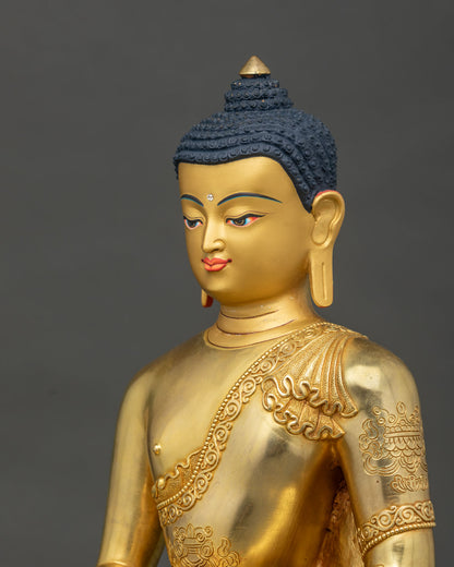 Amitabha Buddha Statue face close up 24K gold painted face.