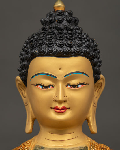Amitabha Buddha statue face close up serene expression 24K gold.