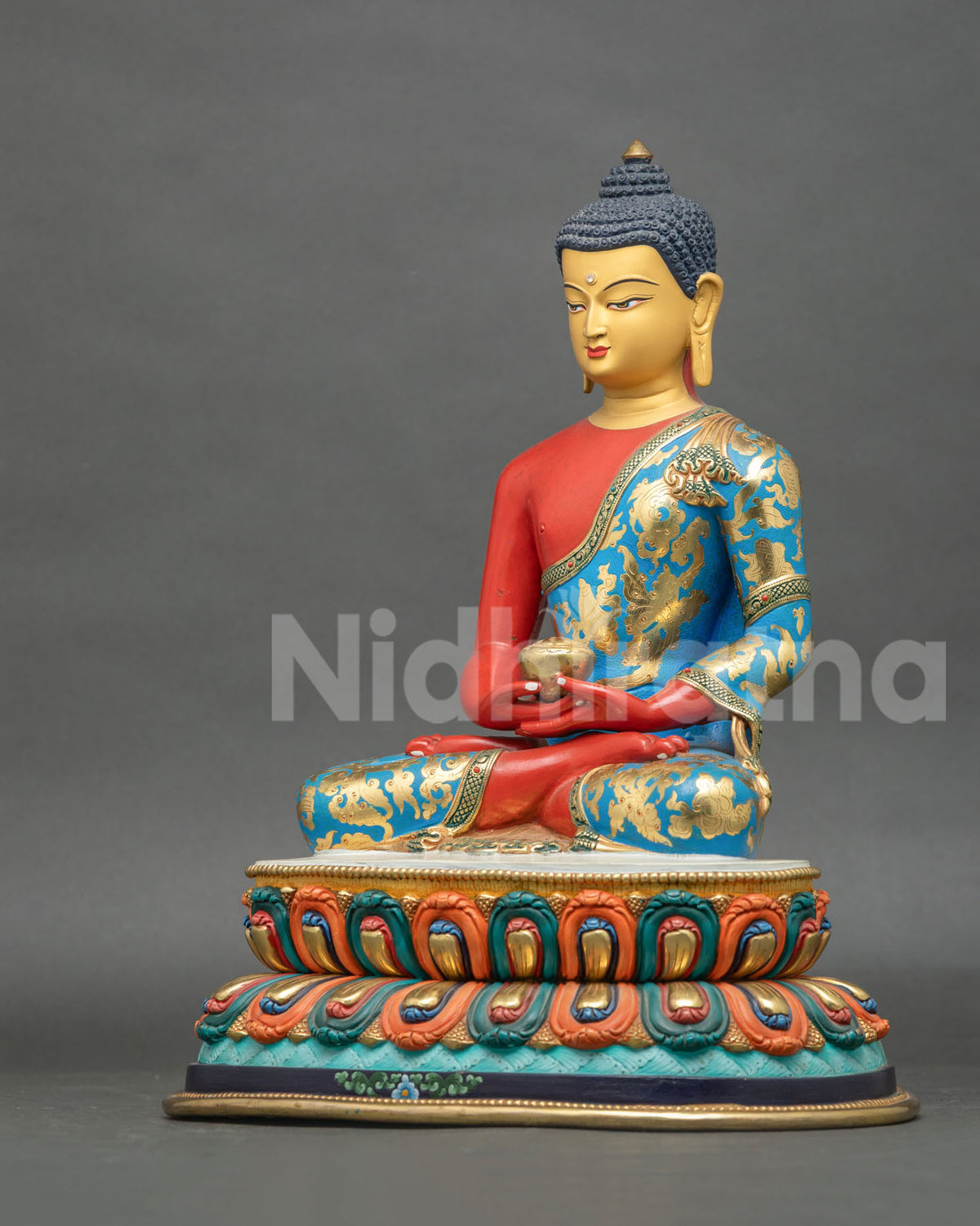 Amitabha Buddha statue gold floral robe motifs and colorful lotus base.