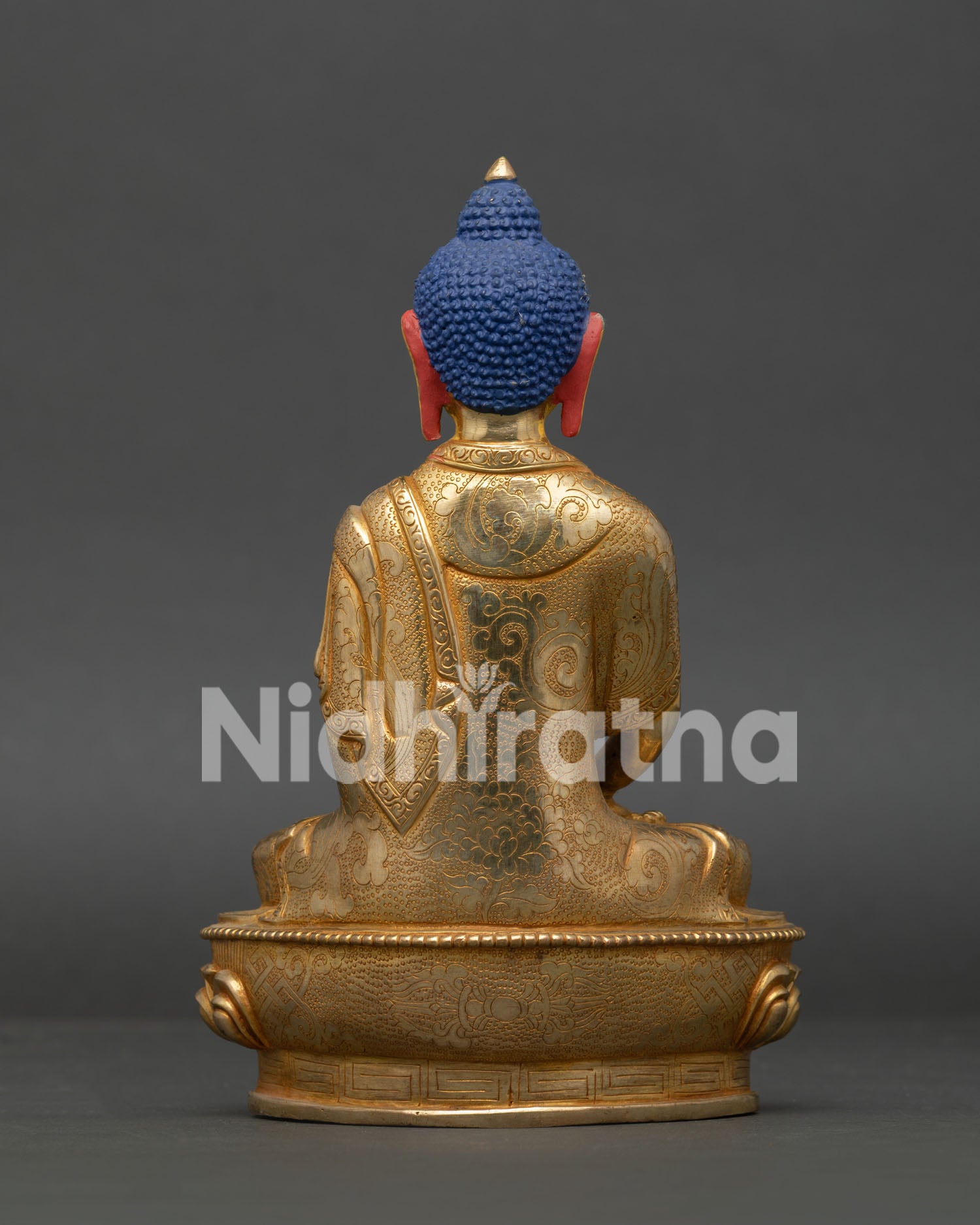 Amitabha Buddha Statue handcrafted from copper with gold gilded details in Nepal.