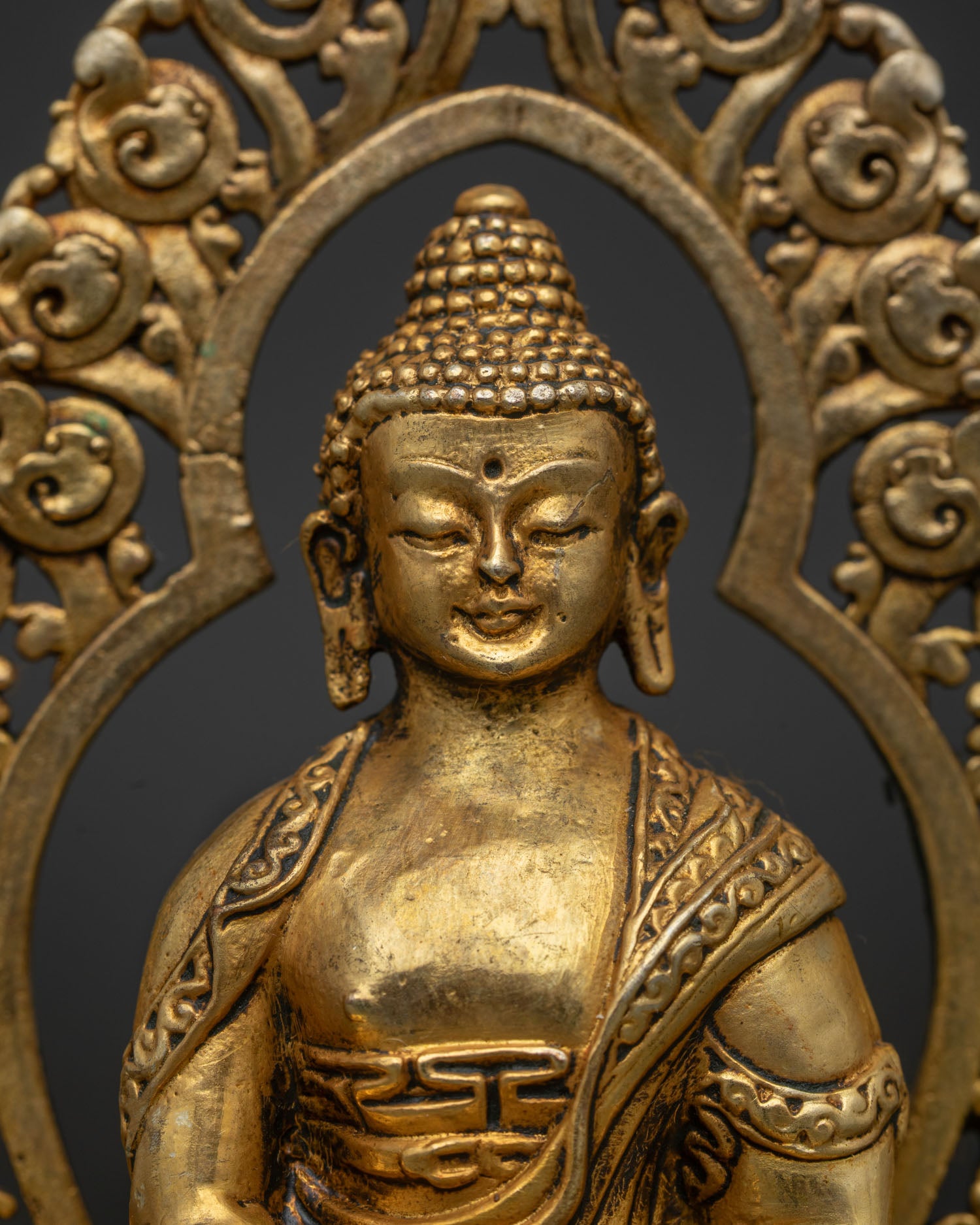 Amitabha Buddha Statue Peaceful Face Ornate Halo Detailed Close Up.