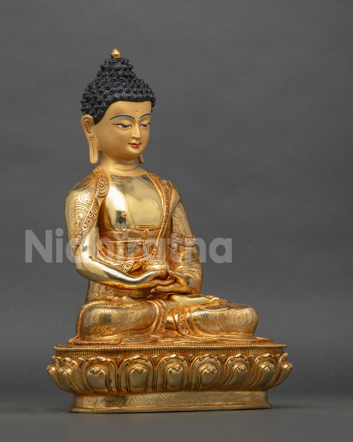 Amitabha Buddha statue right side view lotus pedestal gold gilded.