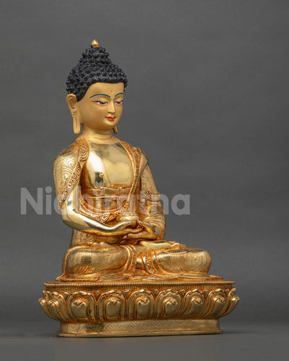 Amitabha Buddha statue right side view lotus pedestal gold gilded.