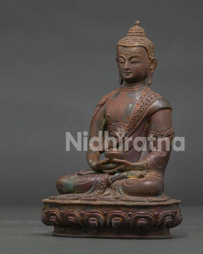 Amitabha Buddha statue seated in Dhyana Mudra on an ornate lotus pedestal.