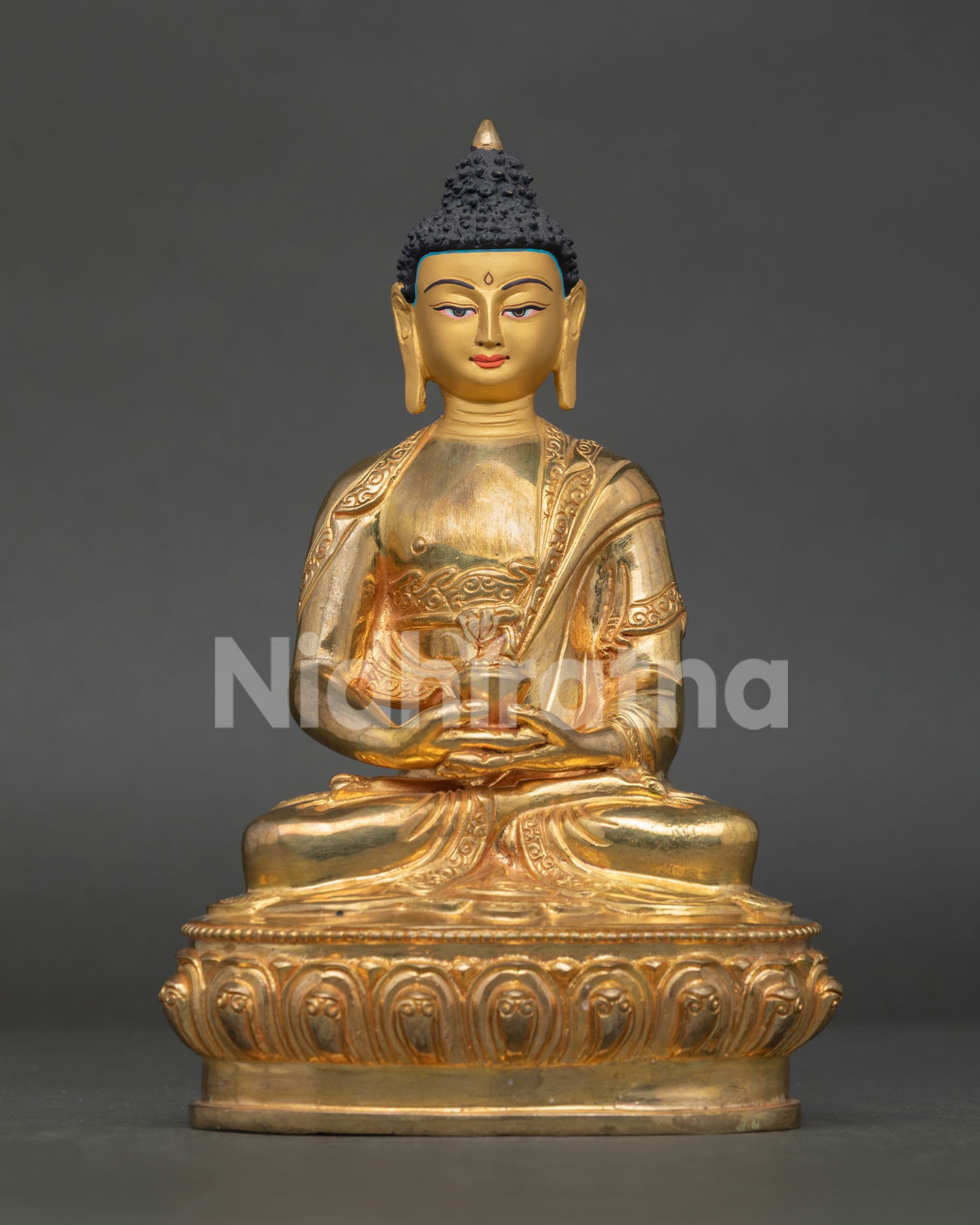 Amitabha buddha statue seated on lotus throne in deep meditation posture with sacred details.