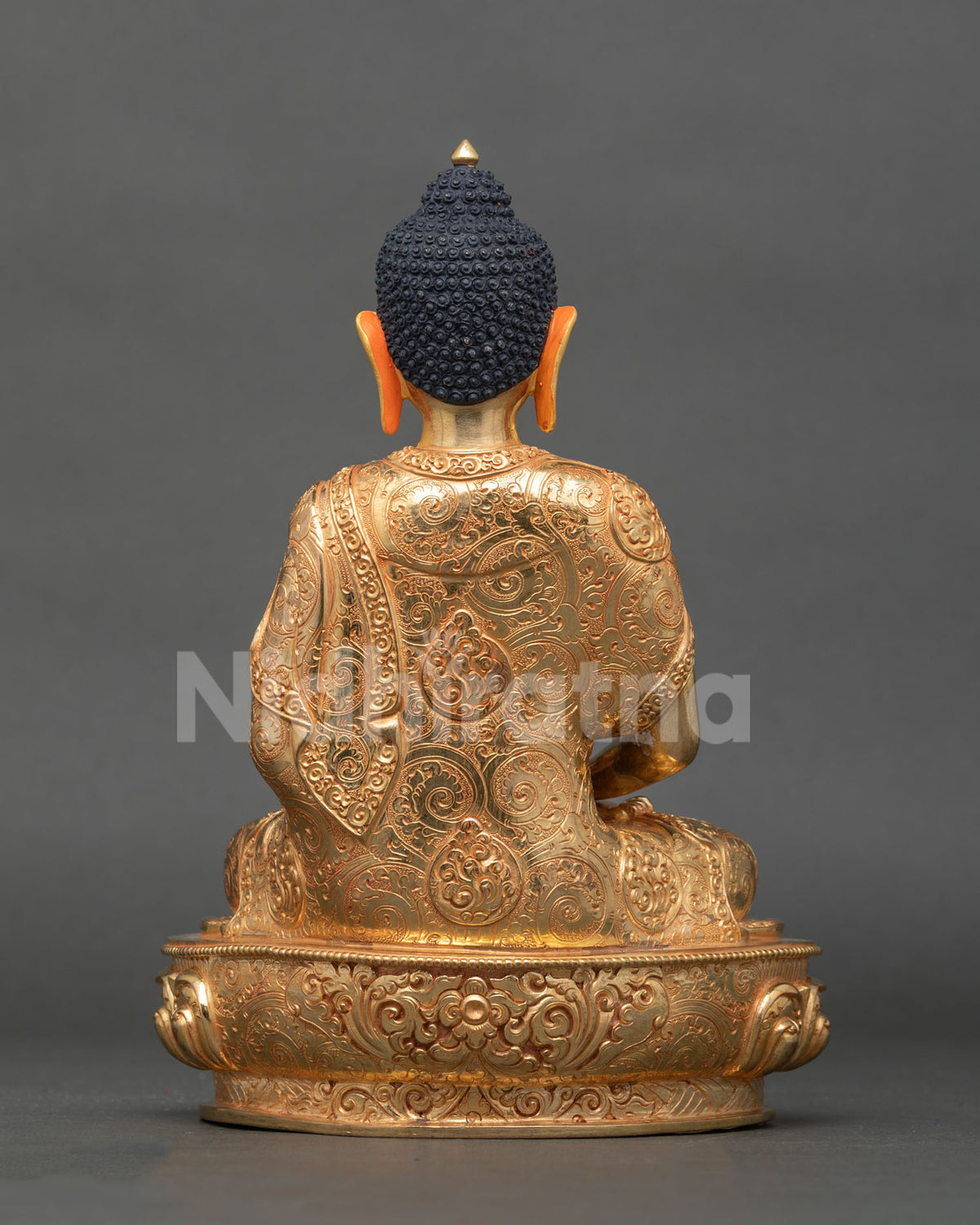 Amitabha Buddha statue seated on lotus throne western pure land.