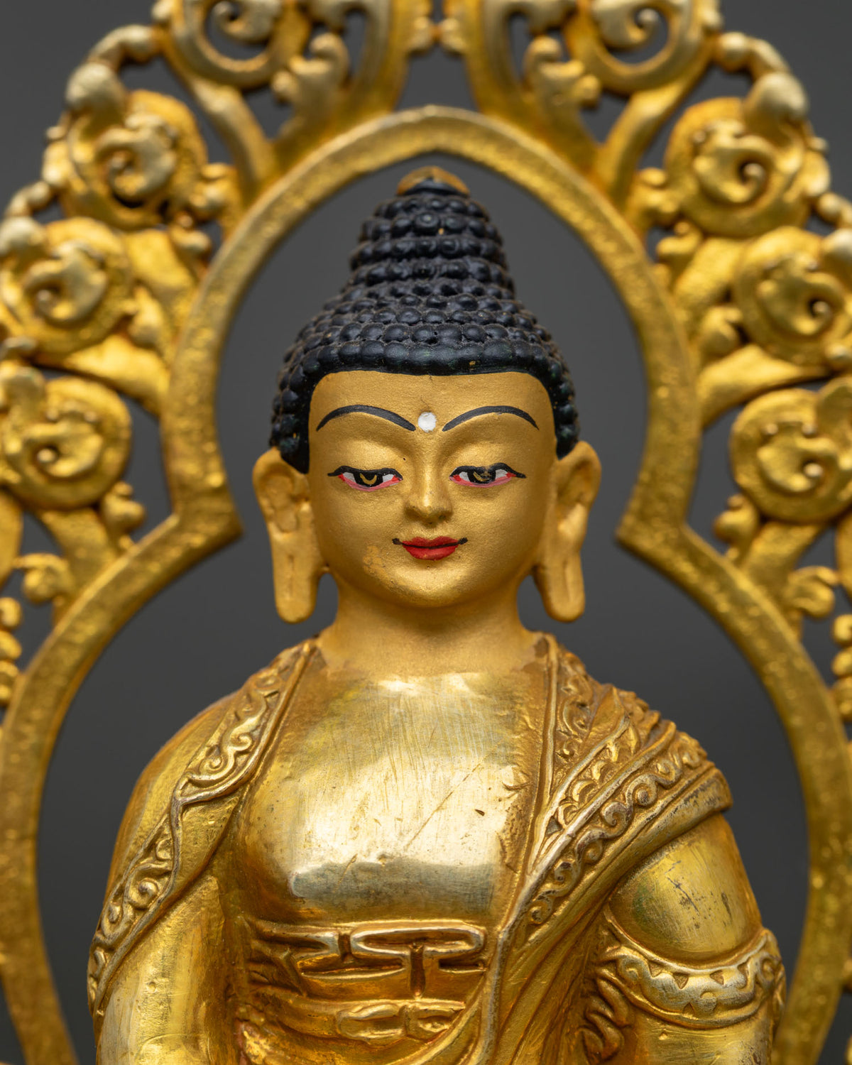 Amitabha Buddha statue showing dhyana mudra and sacred alms bowl.