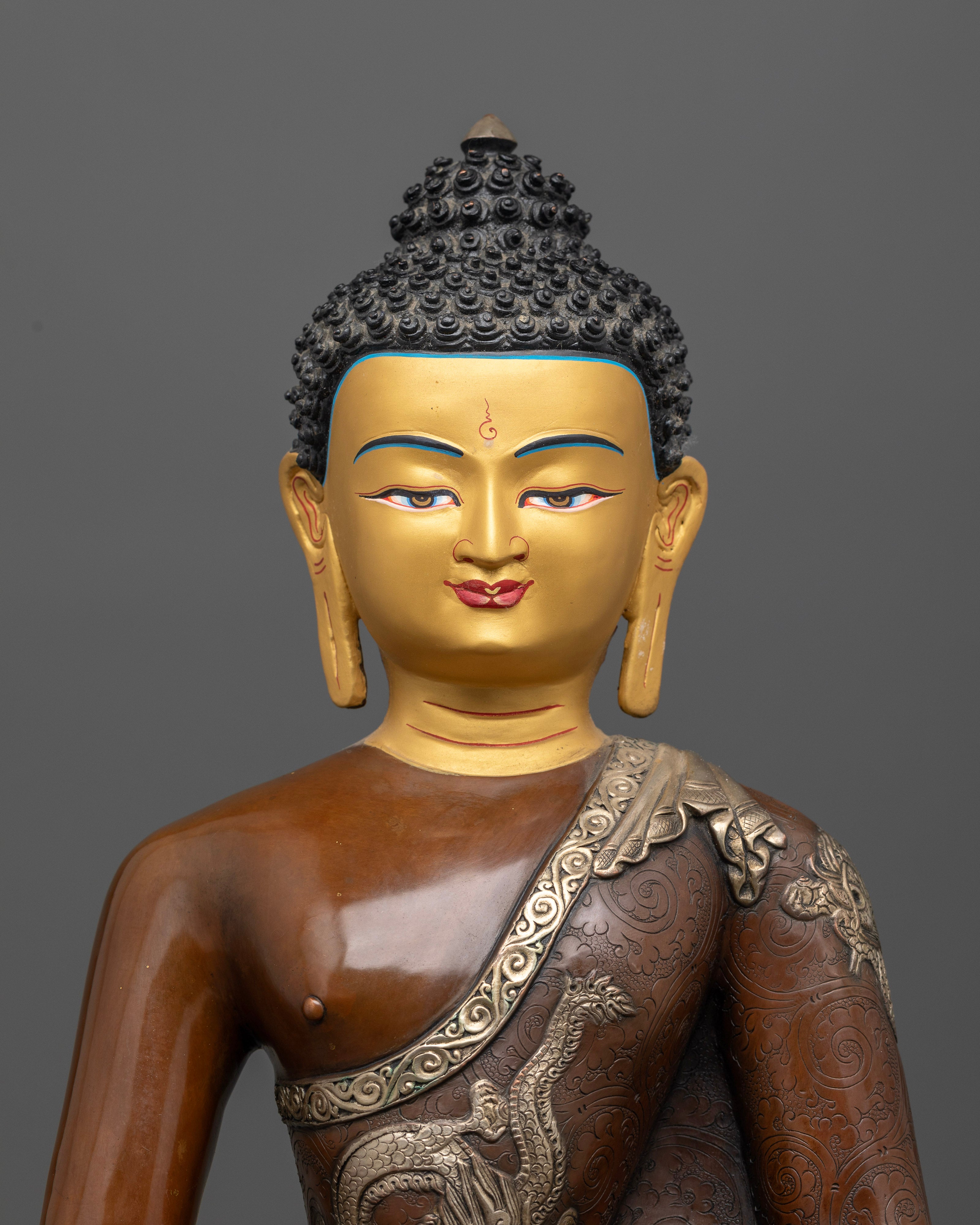 Amitabha Buddha statue with 24K gold painted face and peaceful expression.