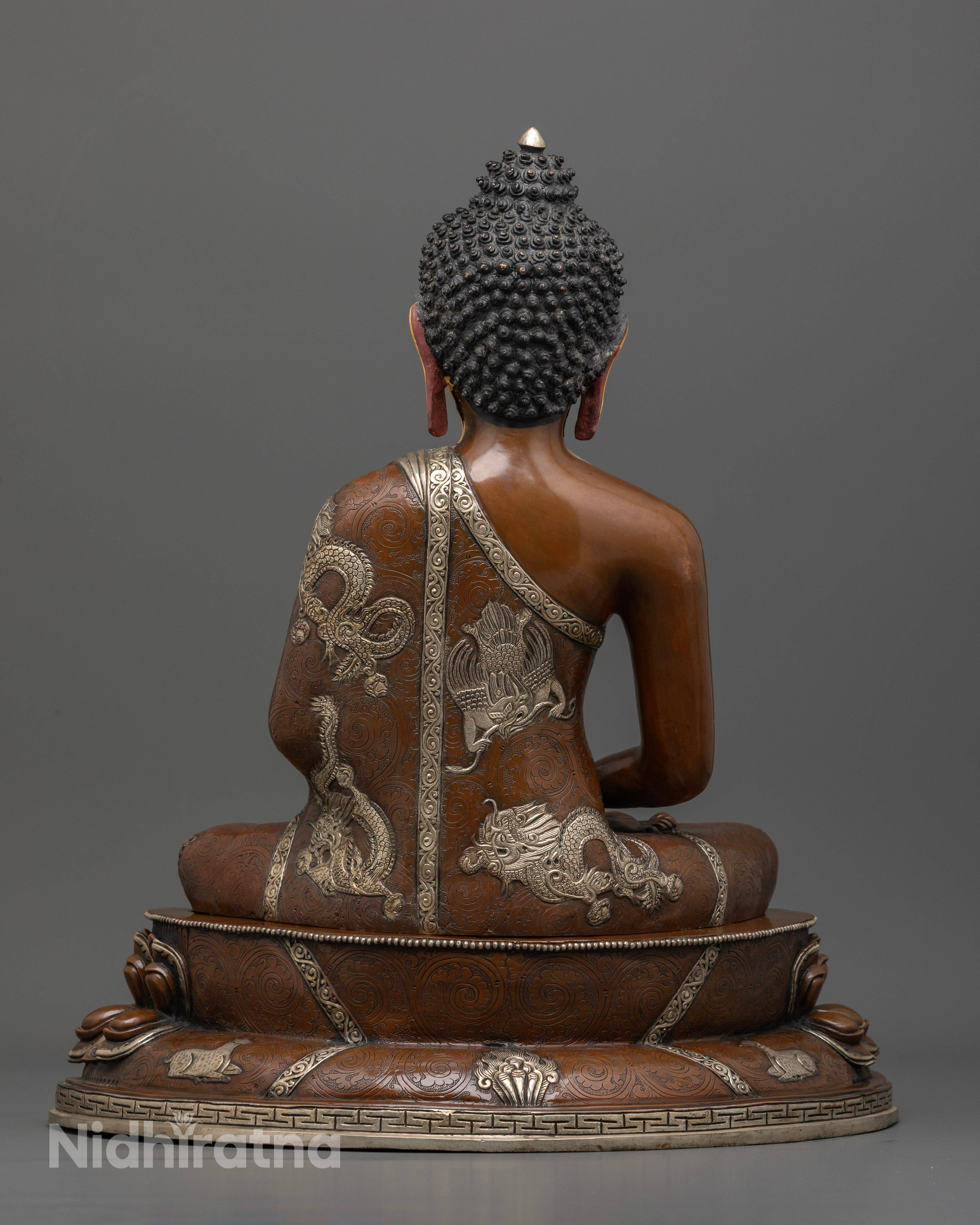 Amitabha Buddha statue with hand carved deer and silver plated dragon motifs.