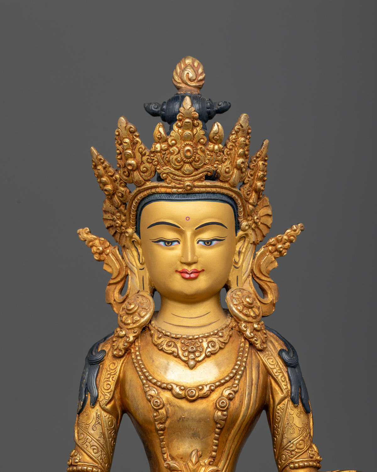 Amitayus Buddha gold-painted face with intricate details and traditional Newari metalwork