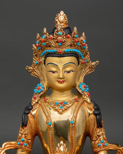 Amitayus Buddha statue close up showing gold gilded details and sacred ornaments