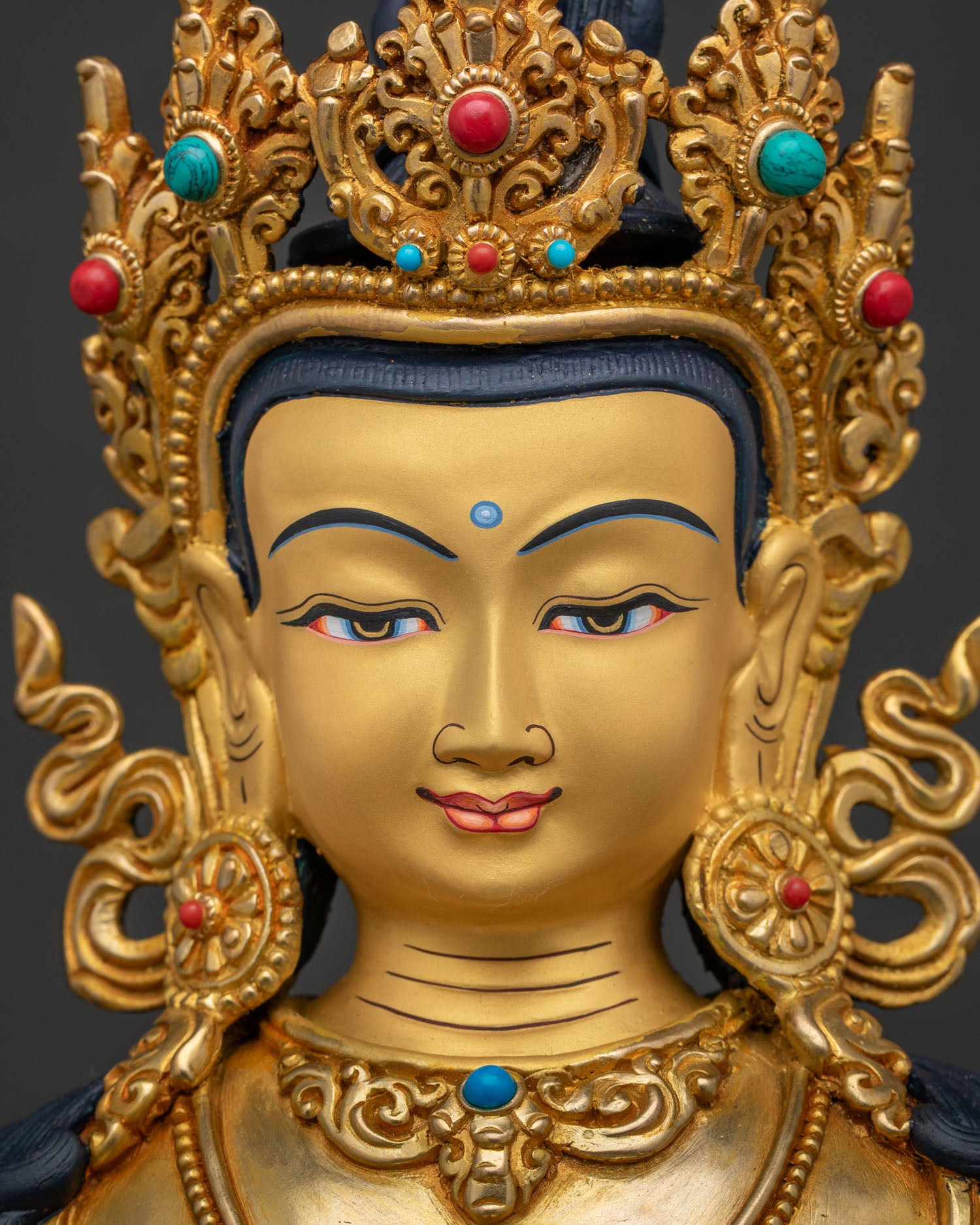 Amitayus Buddha statue face close-up, gold-painted serene expression, Nepal art