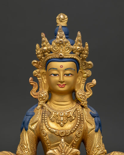 Amitayus Buddha statue gold painted face and ambrosia vase.