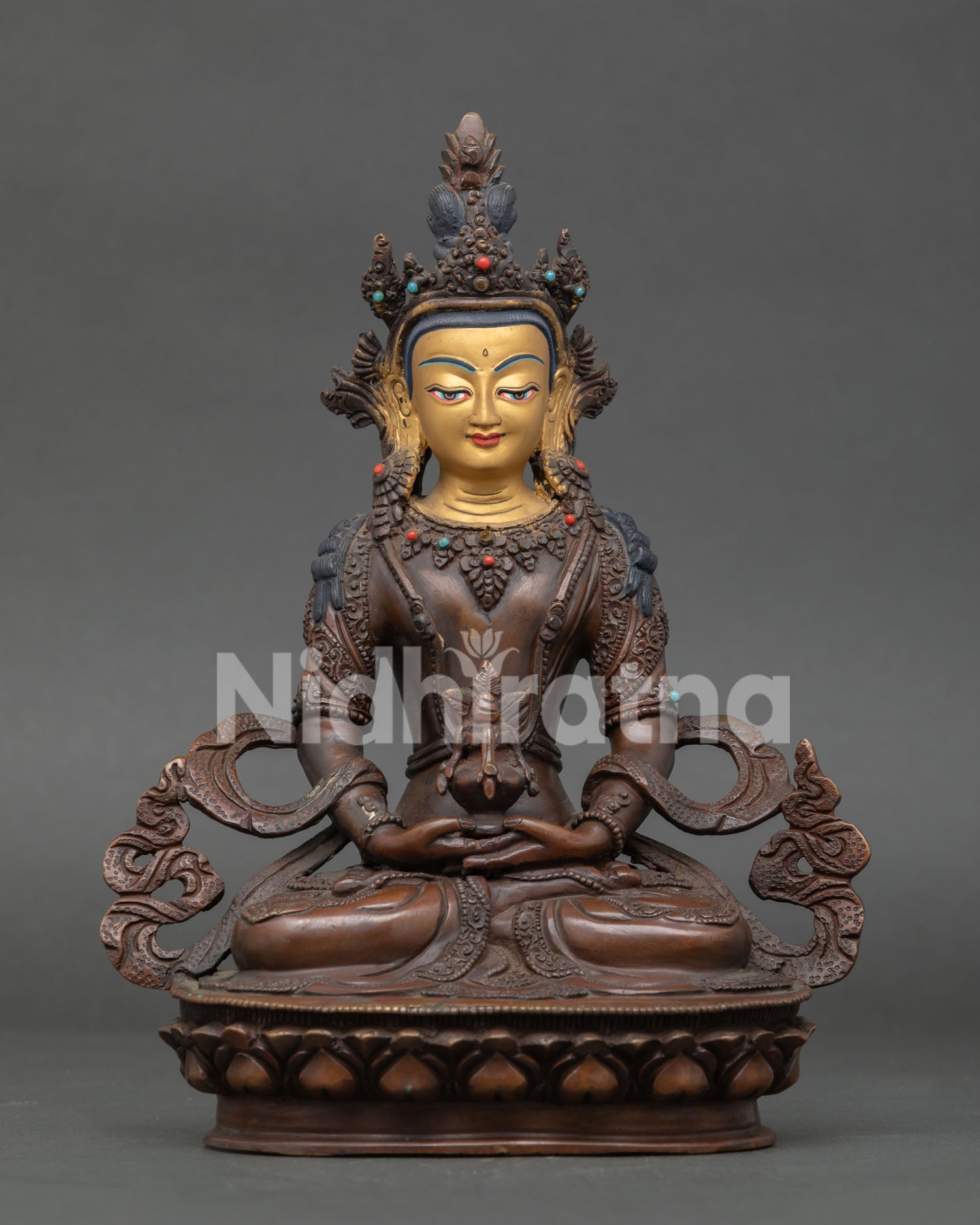 Amitayus Buddha statue handcrafted in copper with oxidized finish and gold painted face from Nepal.