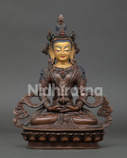Amitayus Buddha statue handcrafted in copper with oxidized finish and gold painted face from Nepal.
