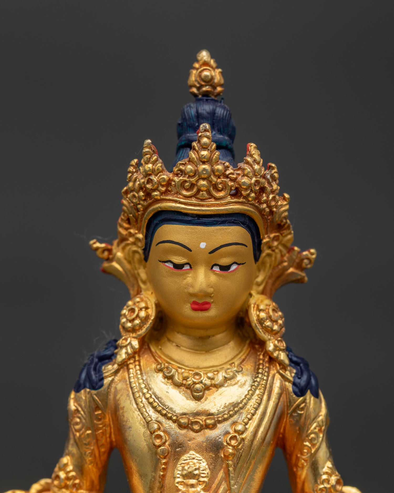Amitayus Buddha statue handcrafted in Nepal with painted face.