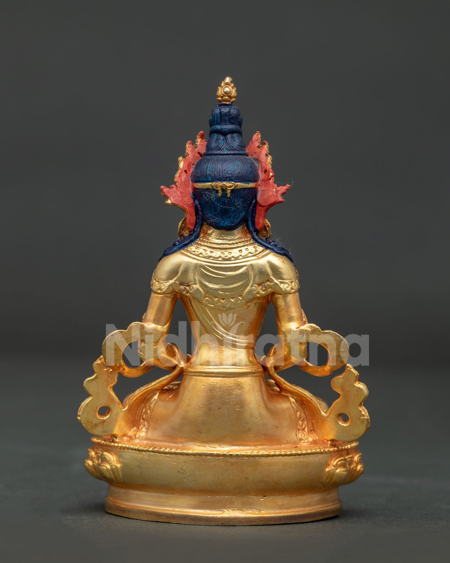 Amitayus Buddha statue on lotus pedestal with detailed Nepalese craftsmanship.