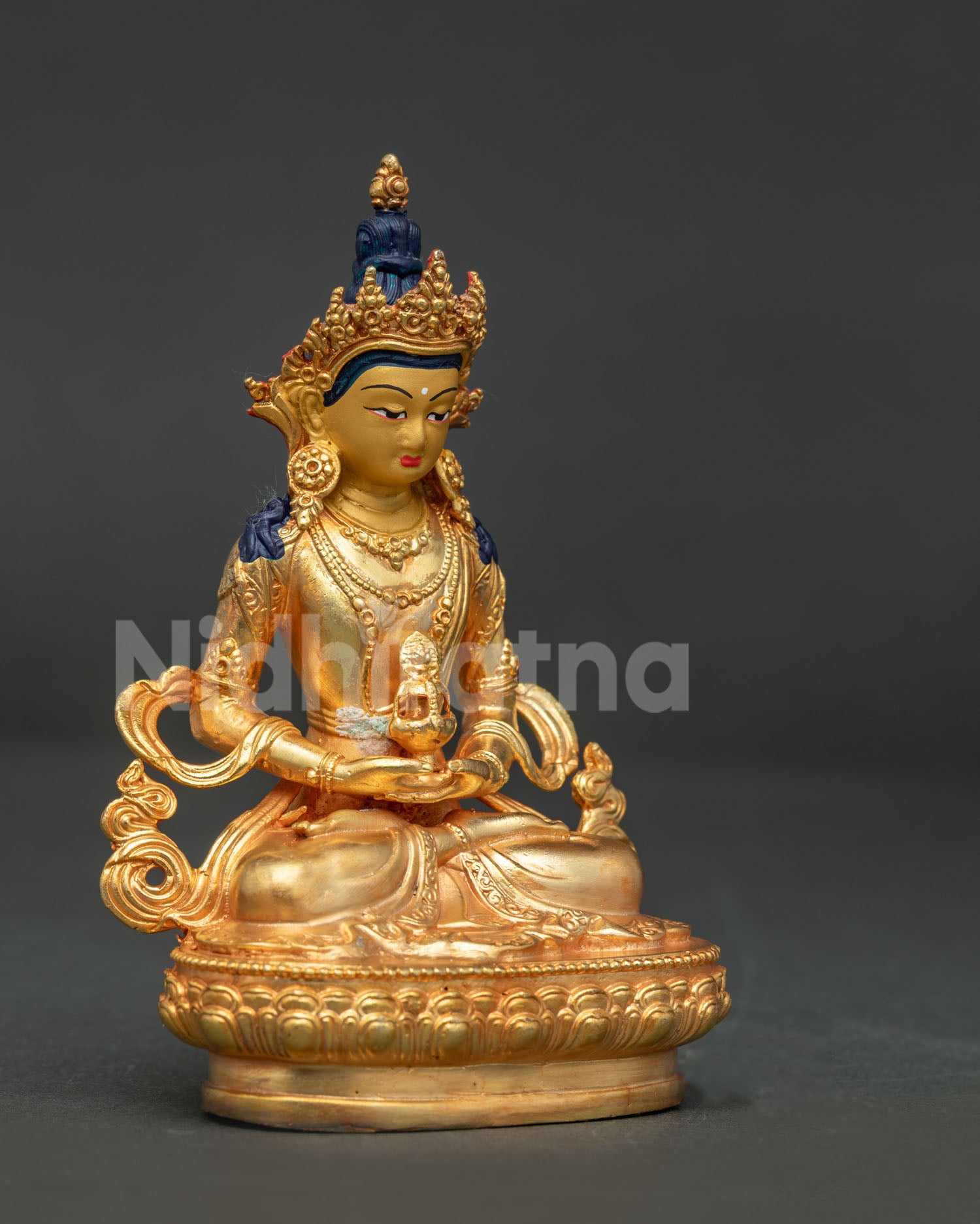 Amitayus Buddha statue seated in Dhyana Mudra holding sacred vase.