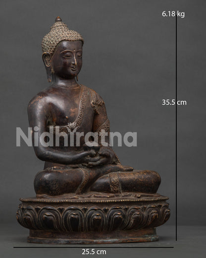 Amitayus Buddha statue seated on lotus pedestal holding sacred alms bowl.