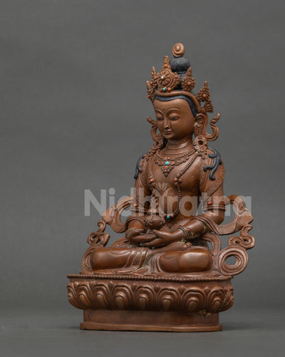Amitayus Buddha statue semi precious stones silk garment layered necklaces.