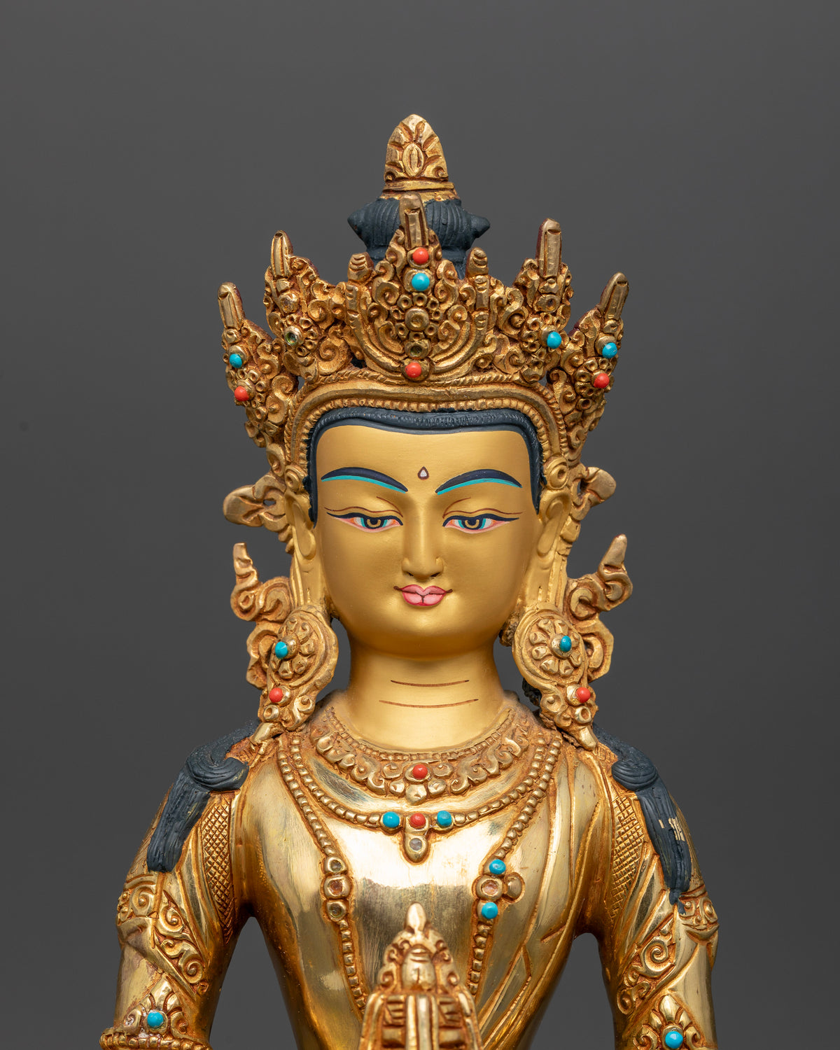 Amitayus Buddha statue with 24K gold face, turquoise and coral stone details.