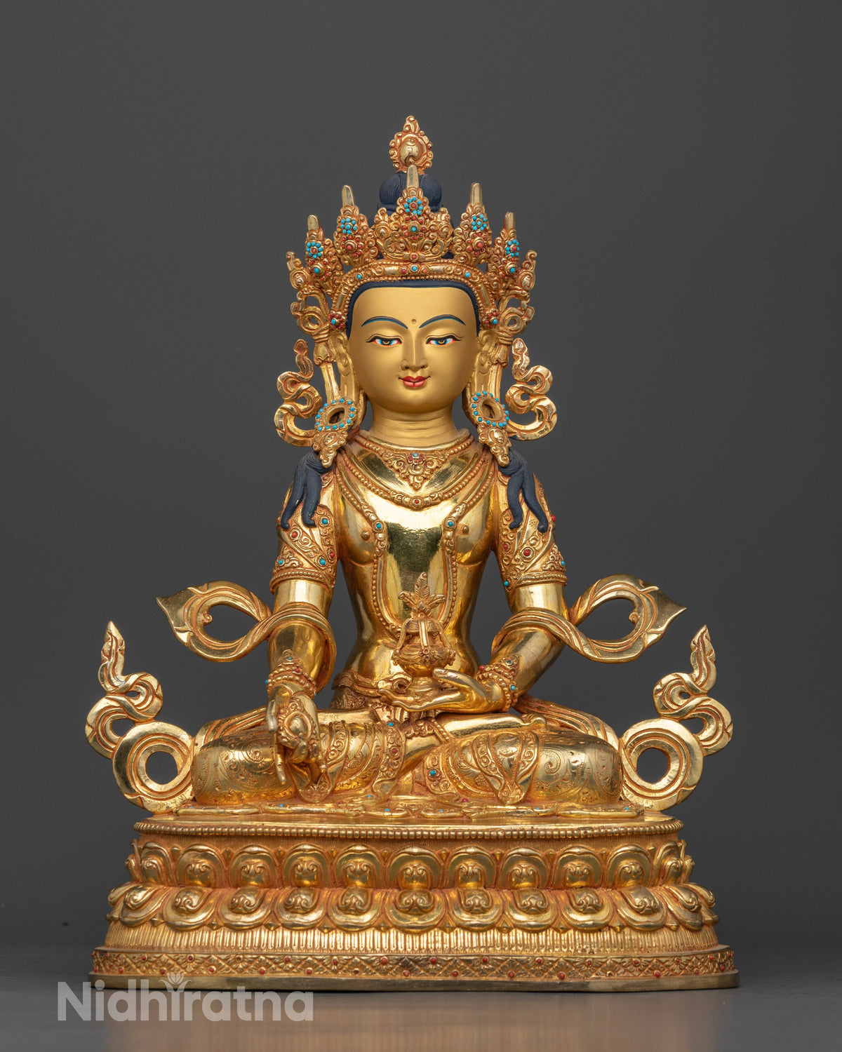Amitayus Buddha statue with gold fire gilding and semi precious stones.