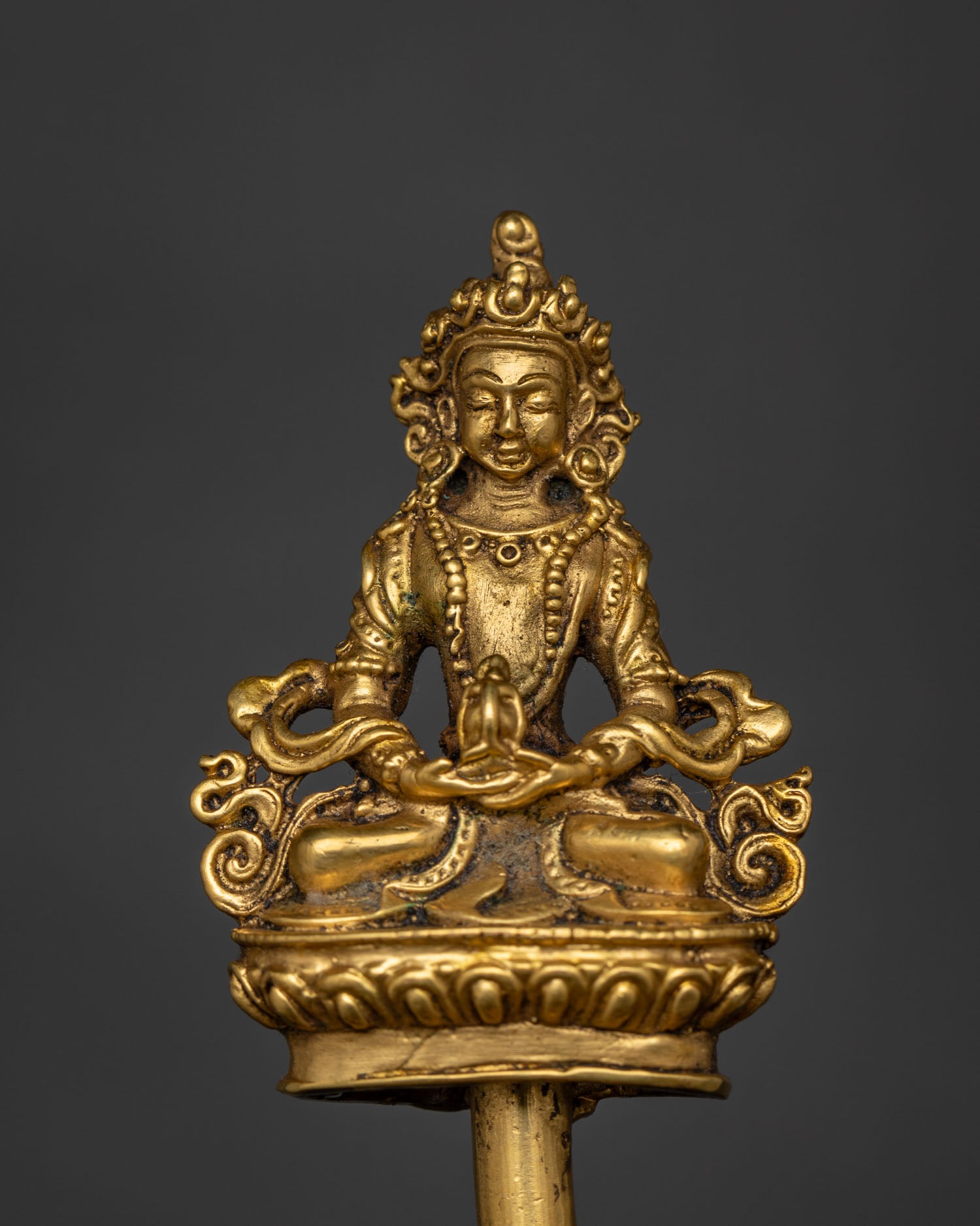 Amitayus figure crowning the halo behind the Dzambhala Statue