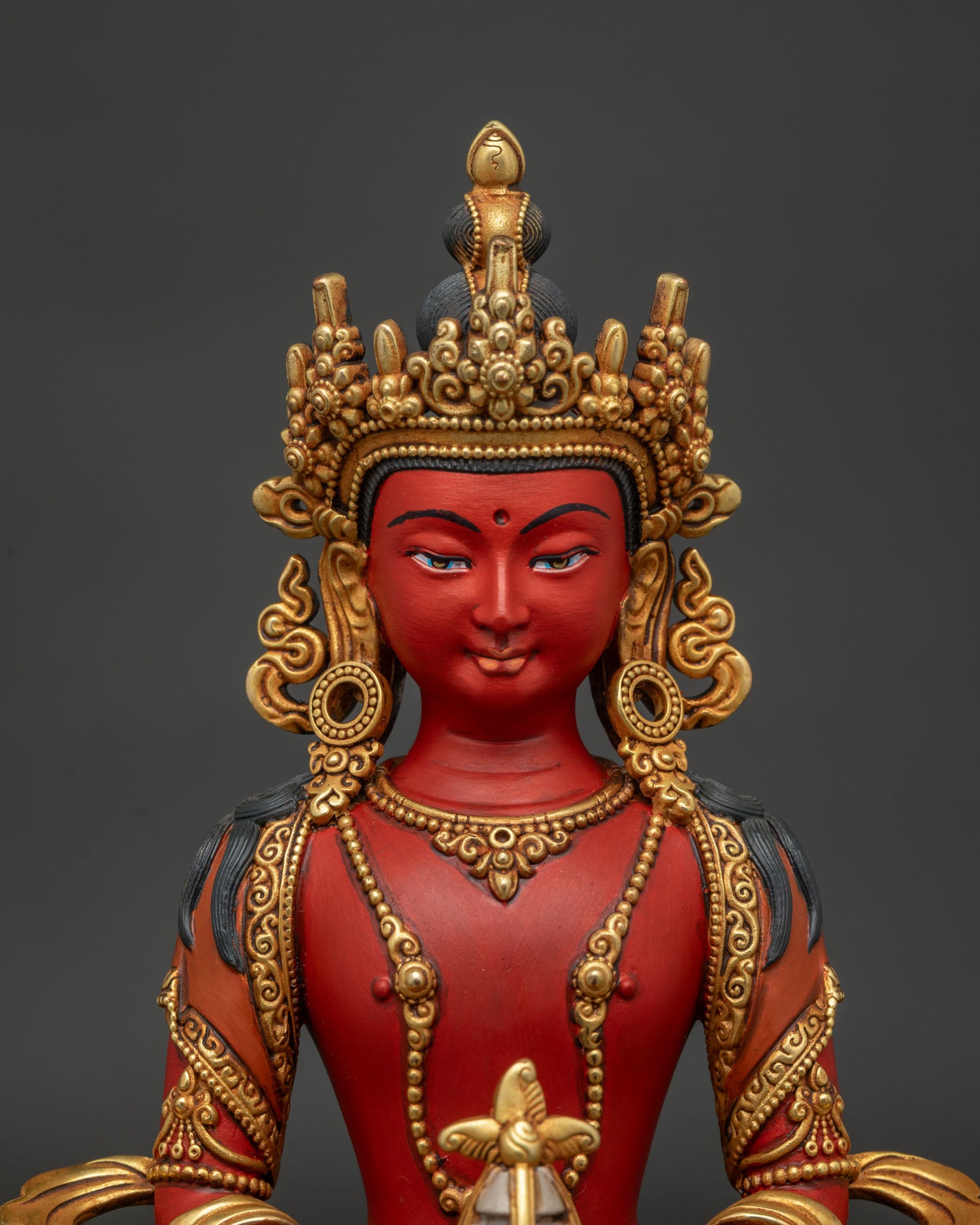 amitayus statue close up showing lotus seat longevity vase and acrylic painting details