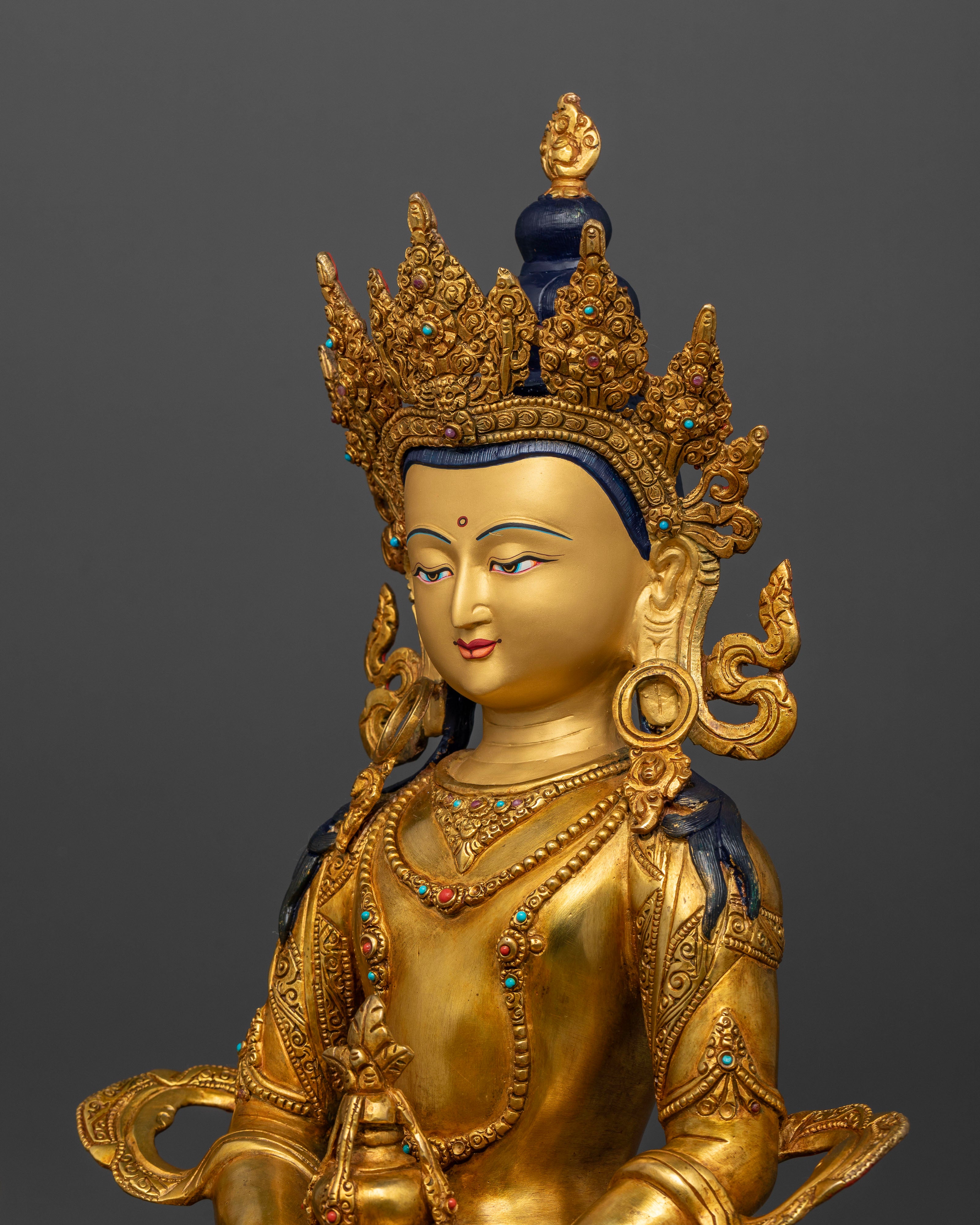 Amitayus Statue close up view showing five jewel crown and semi precious stone ornaments