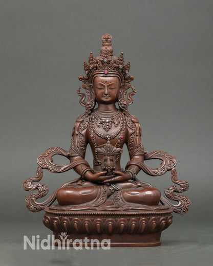 Amitayus statue handcrafted in Nepal oxidized copper, Buddha of infinite life, seated on lotus pedestal holding vase of immortal nectar