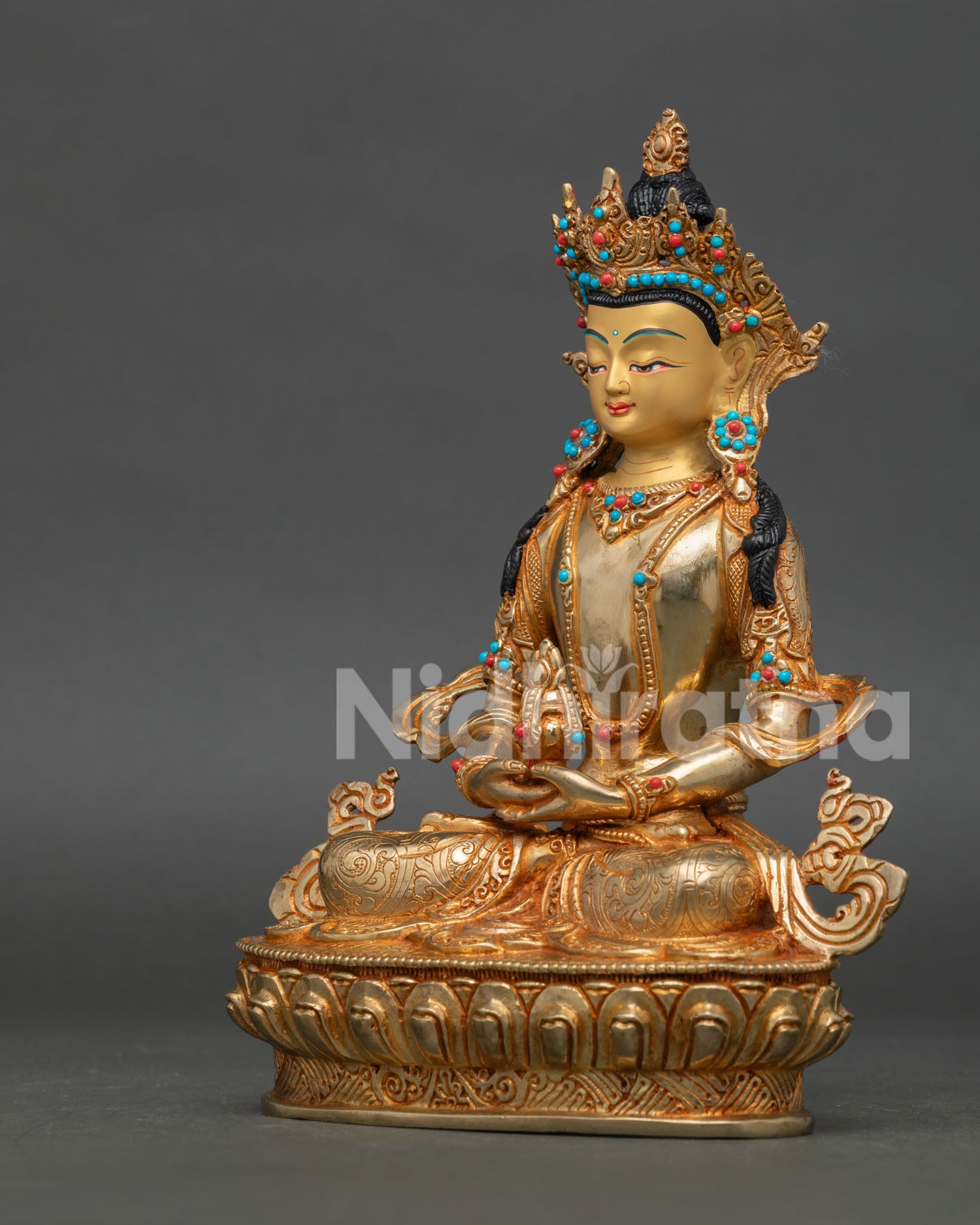 Amitayus statue holding ambrosia vase in dhyanamudra on lotus pedestal.