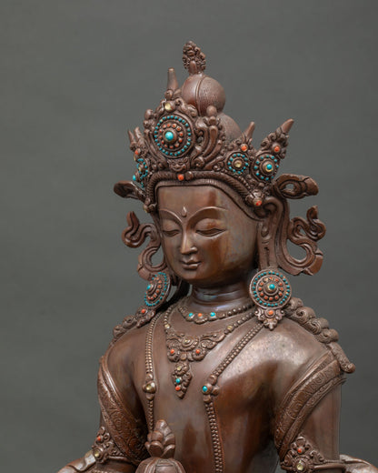 Amitayus statue holding kalasha sacred vase with delicately engraved robes.