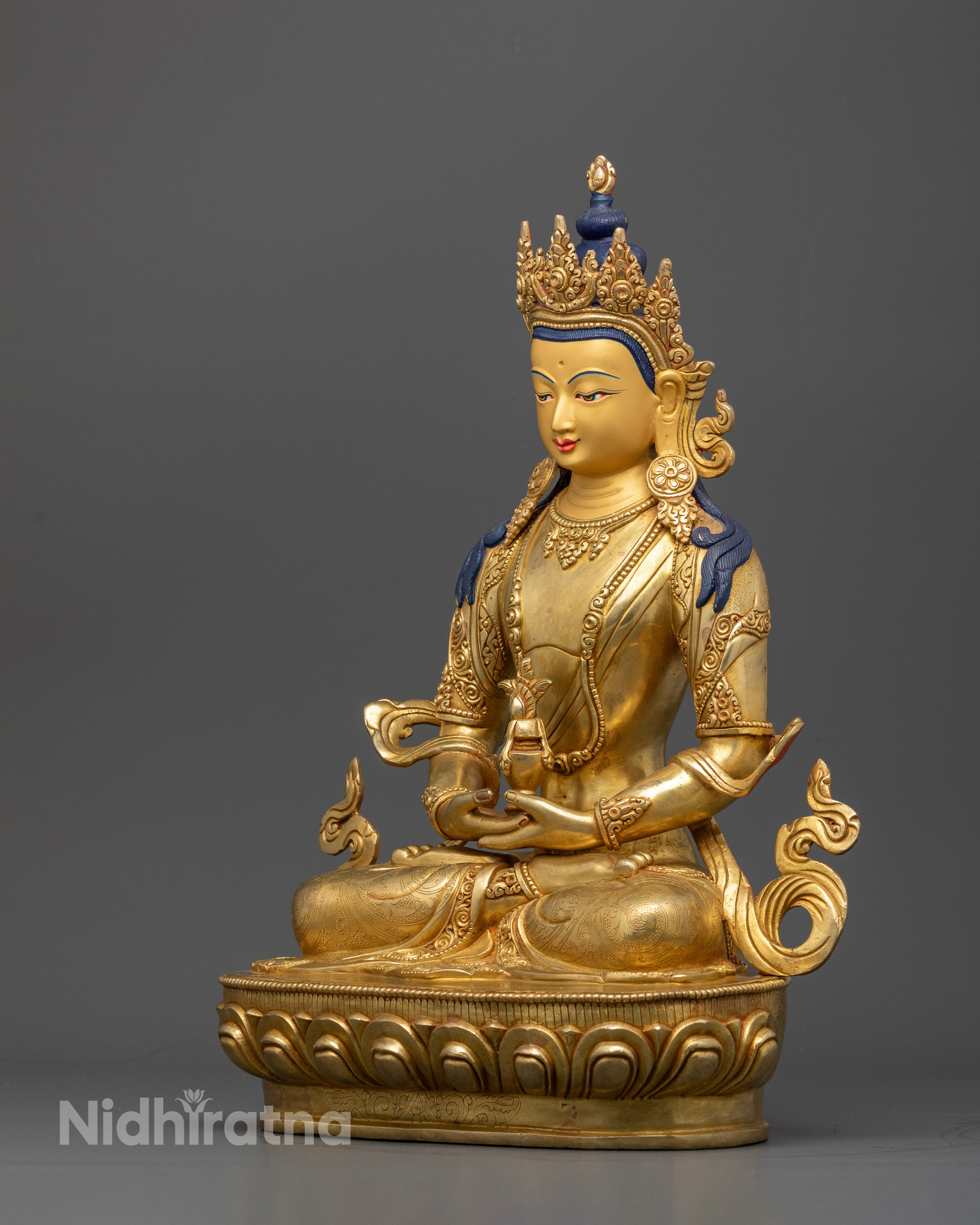 Amitayus statue holding longevity vase in padmasana on lotus pedestal.