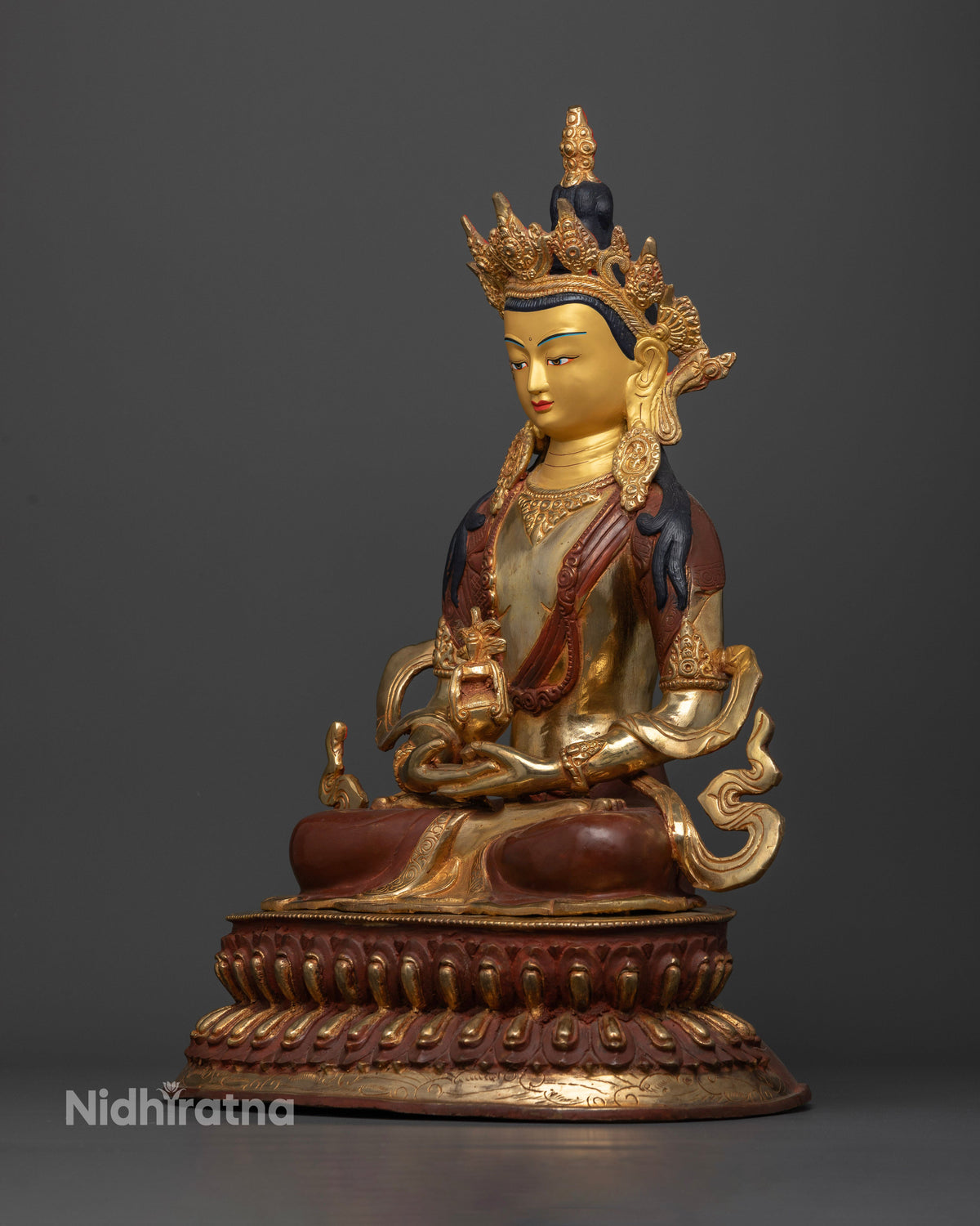 Amitayus statue left side view with oxidized copper and gold fire gilding.